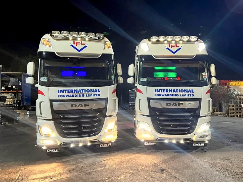 IFL DAF trucks lit up at night