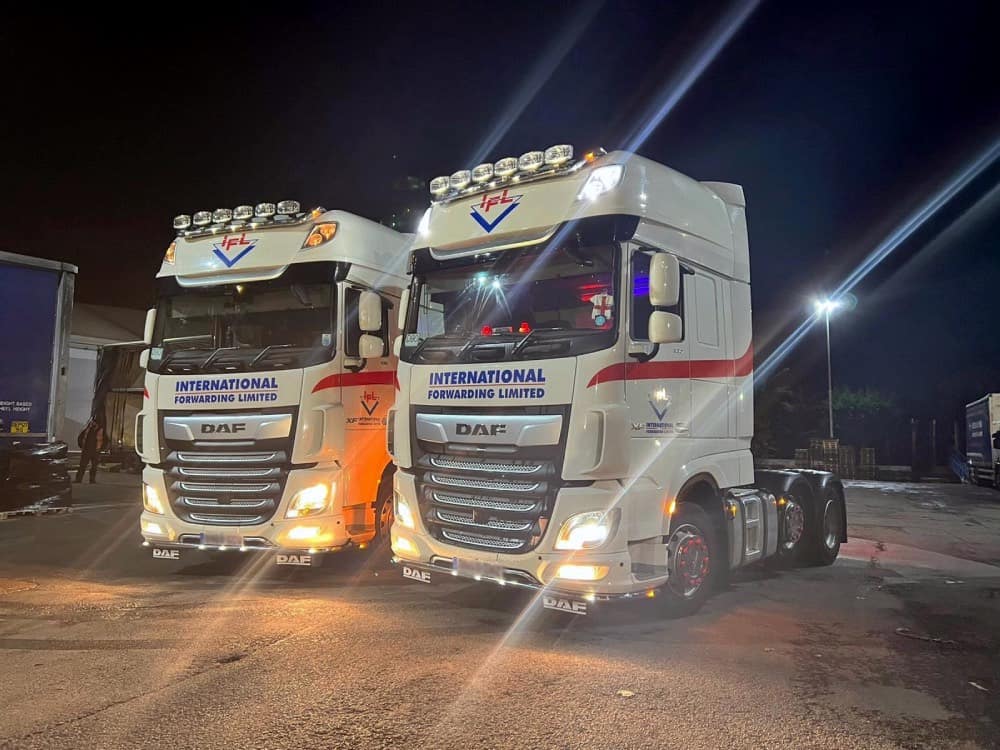 IFL DAF trucks lit up at night